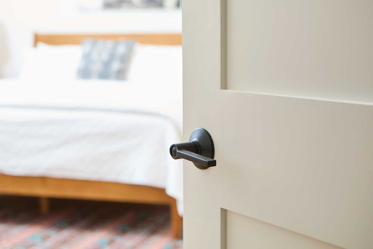 2-Panel Interior wood door opening into bedroom
